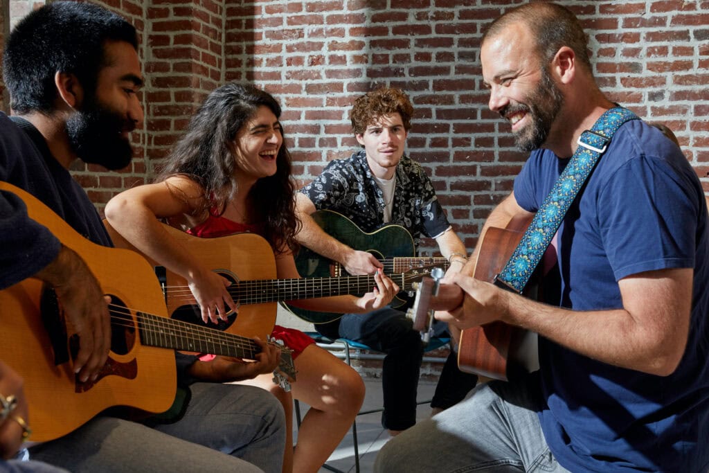 HVS Conservatory students in a group guitar class.