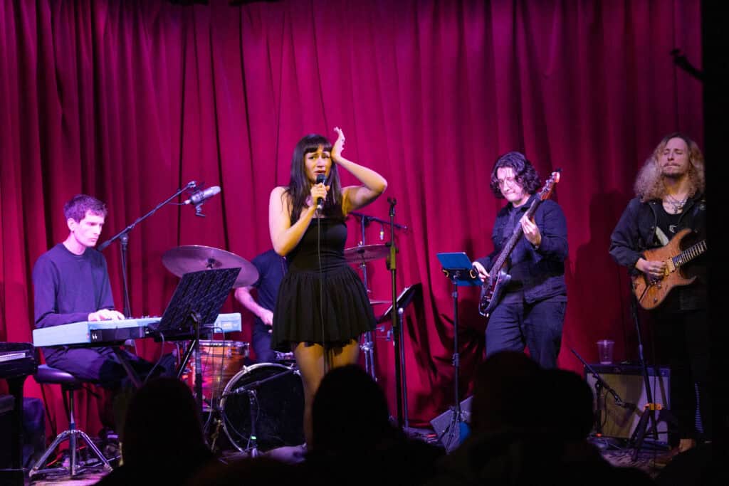 band performing live on stage thanks to a Growth Mindset for Singers